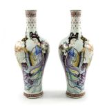 A pair of Chinese porcelain baluster vases, 20th Century with Qianlong seal marks, extended