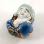 A Japanese Hirado porcelain netsuke of a Hirado boy, Edo period (1603-1868), from Emperor kiln,