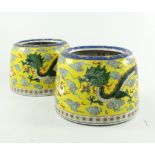 A pair of Chinese low jardinieres, late 19th or early 20th Century, of tapered cylinder form,