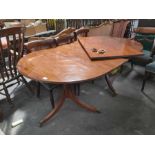 A mahogany D-end dining table with one insertion, 136cm total length