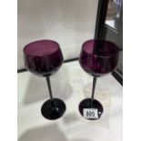 A pair of amethyst tinted wine glasses, purchased Laurie Lee 1999