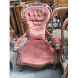 19th century Walnut open arm elbow chair, apholstered in salmon pink button fabric on cabriole suppo