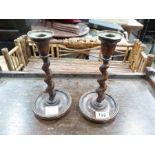 A pair of brass topped barley twist candlesticks, 23cm high (2)