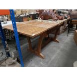 An oak draw leaf table on twin end standard supports, 183cm long