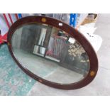 An inlaid mahogany bevelled plate glass wall mirror, 73cm wide