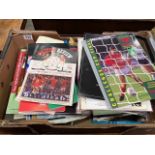 A box of various theatre and football programmes