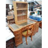 A yew wood twin pedestal writing desk, 116cm wide and chair, together with an oak two tier bookcase