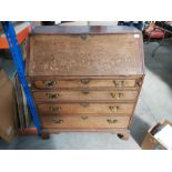 A George III mahogany crossbanded oak full front writing bureau with fitted interior and four gradua
