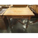 An Edwardian oak writing bureau/bookcase, 82cm wide, and an oak draw leaf table on barley twist supp