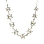 An Edwardian diamond bow necklace