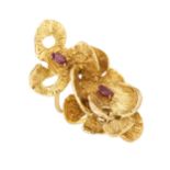 A mid 20th century 14ct gold ruby textured floral dress ring