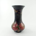 William Moorcroft, circa 1915, a large pomegranate baluster vase of bulbous form with flared