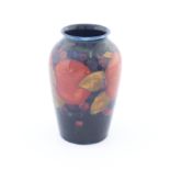 William Moorcroft, circa 1928, a small pomegranate tapered vase of shouldered form, impressed