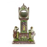 A Dixon & Austin Sunderland pink lustre watch stand, circa 1820, in the form of a longcase clock