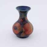 A William Moorcroft pomegranate vase, circa 1920, baluster form with flared rim, impressed marks and