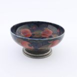 William Moorcroft for Liberty & Co, circa 1928, a pomegranate bowl on a hammered pewter base, No.