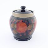 William Moorcroft, circa 1920, a pomegranate covered biscuit jar with pewter mount, impressed marks,