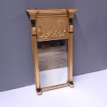 A Regency gilt wood pier looking glass, circa 1820 and later, plain cornice, the frieze with a