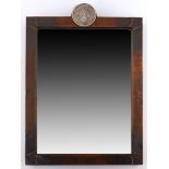 An Arts & Crafts copper framed wall mirror, circa 1910, hammered finish throughout with studded