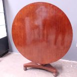 A mid Victorian plum pudding mahogany breakfast table, circa 1860, circular tilt top, tapered