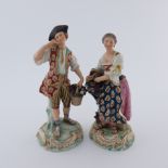 A pair of late 19th Century Samson gentleman and lady vintner companion figures, each modelled