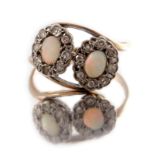 A mid 20th century 9ct gold and platinum, opal and diamond double cluster ring