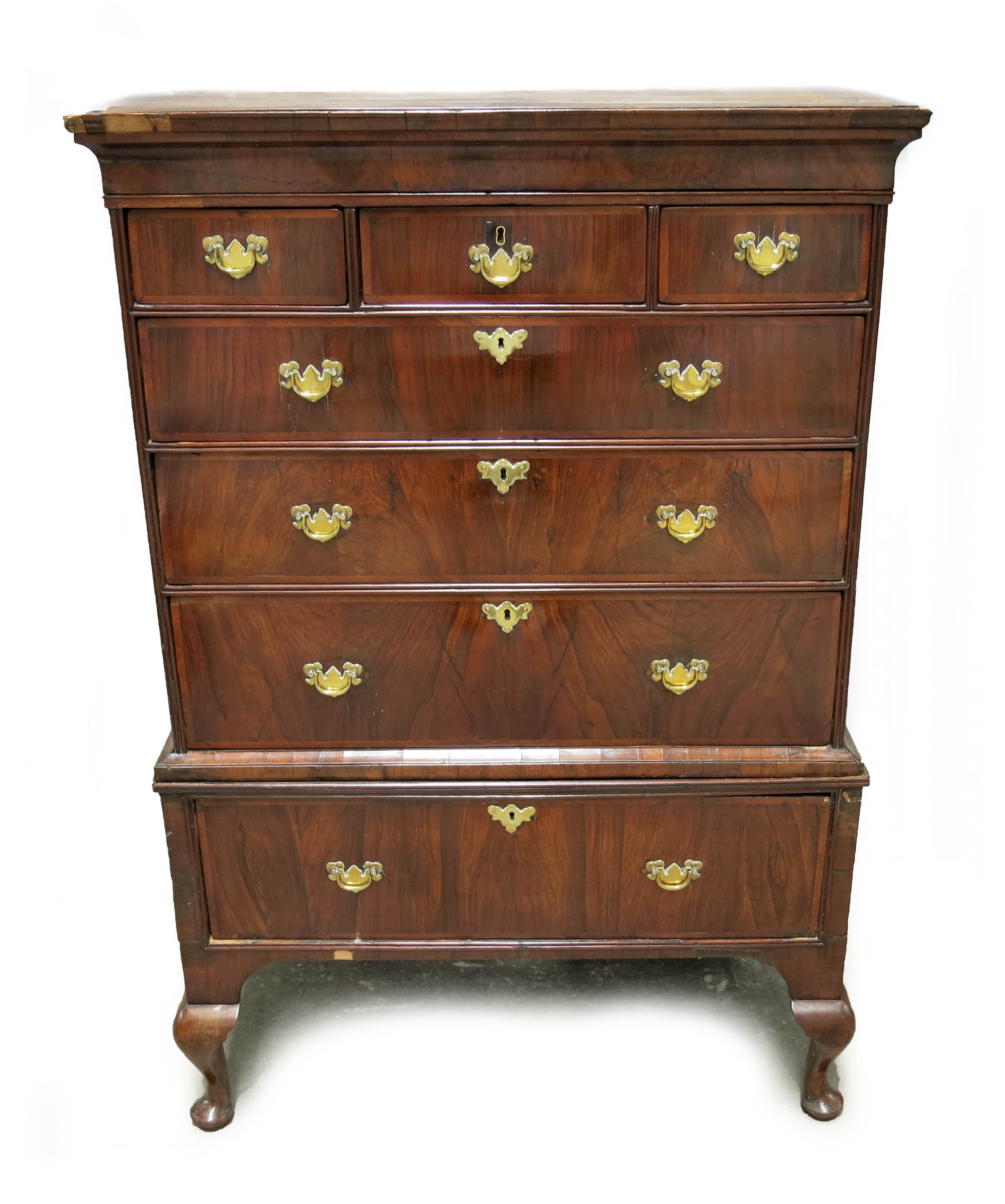 A George II figured walnut chest on stand, circa 1750, moulded cornice long drawer over three