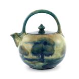 William Moorcroft, a Hazledene teapot, circa 1910, loop handled globular form, tubelined and painted