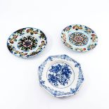 Three various 18th Century English delftware plates, circa 1720-1780, a near pair with polychrome