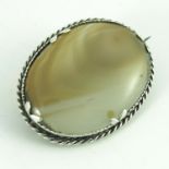 An Arts and Crafts silver and agate brooch