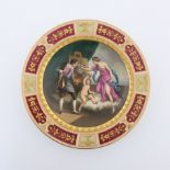 A late 19th Century Vienna cabinet plate, circa 1890, painted with an artist, putti and classical