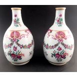 A pair of Samson porcelain bottle vases, late 19th Century, painted in the famille rose palette with