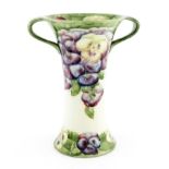 William Moorcroft for James Macintyre, a pansy on white twin handled vase, circa 1912, waisted and