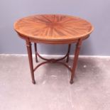 An Edwardian oval mahogany occasional table, circa 1910, crossbanded patera inlaid top, X