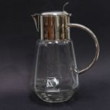 A large faceted metal mounted water jug