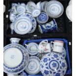 Assorted blue and white Chinese tableware, including rice bowls and spoons, plates, bowls and sundry