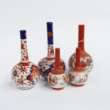 Five Imari and Satsuma pattern bottle vases, and four Oriental plates (9)
