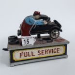 A Cast iron money bank, 'Full Service'