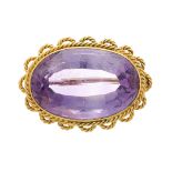 An early 20th century gold, amethyst single-stone brooch