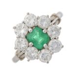 An 18ct gold emerald and diamond cluster ring