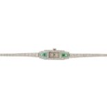 An Art Deco platinum, emerald and diamond cocktail bracelet watch