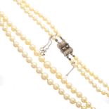 A mid 20th century cultured pearl two-row necklace, with diamond clasp