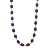 An 18ct gold lapis lazuli necklace and a pair of earrings