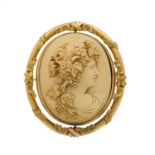 A late Victorian lava cameo swivel brooch, depicting a bacchante