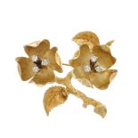 A mid 20th century 14ct gold diamond flower brooch