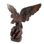 A late 19th Century Black Forest carved wooden desk model of an eagle, circa 1890, carved