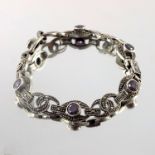 An Art Deco silver, marcasite and amethyst bracelet