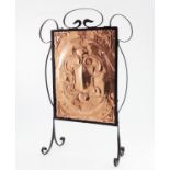 An Arts and Crafts copper and wrought iron fire screen