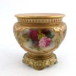 A Royal Worcester jardiniere, circular footed form, moulded gilt decoration reserving four rose