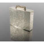 Gerald Benney, a modernist silver table lighter, London 1967, bowed cuboid form with bark textured